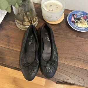 CHANEL Black Quilted Loafers with Bow Accent